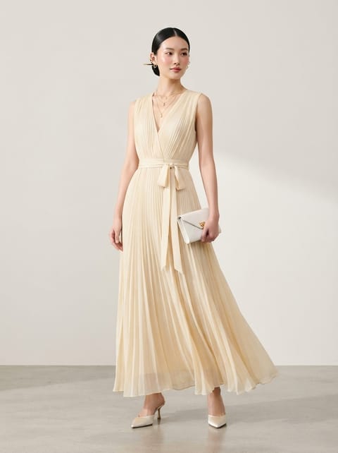 SKIPIKS AI fashion editorial — elegant, feminine — This soft cream pleated dress adds elegance to your style. Complete the look wit
